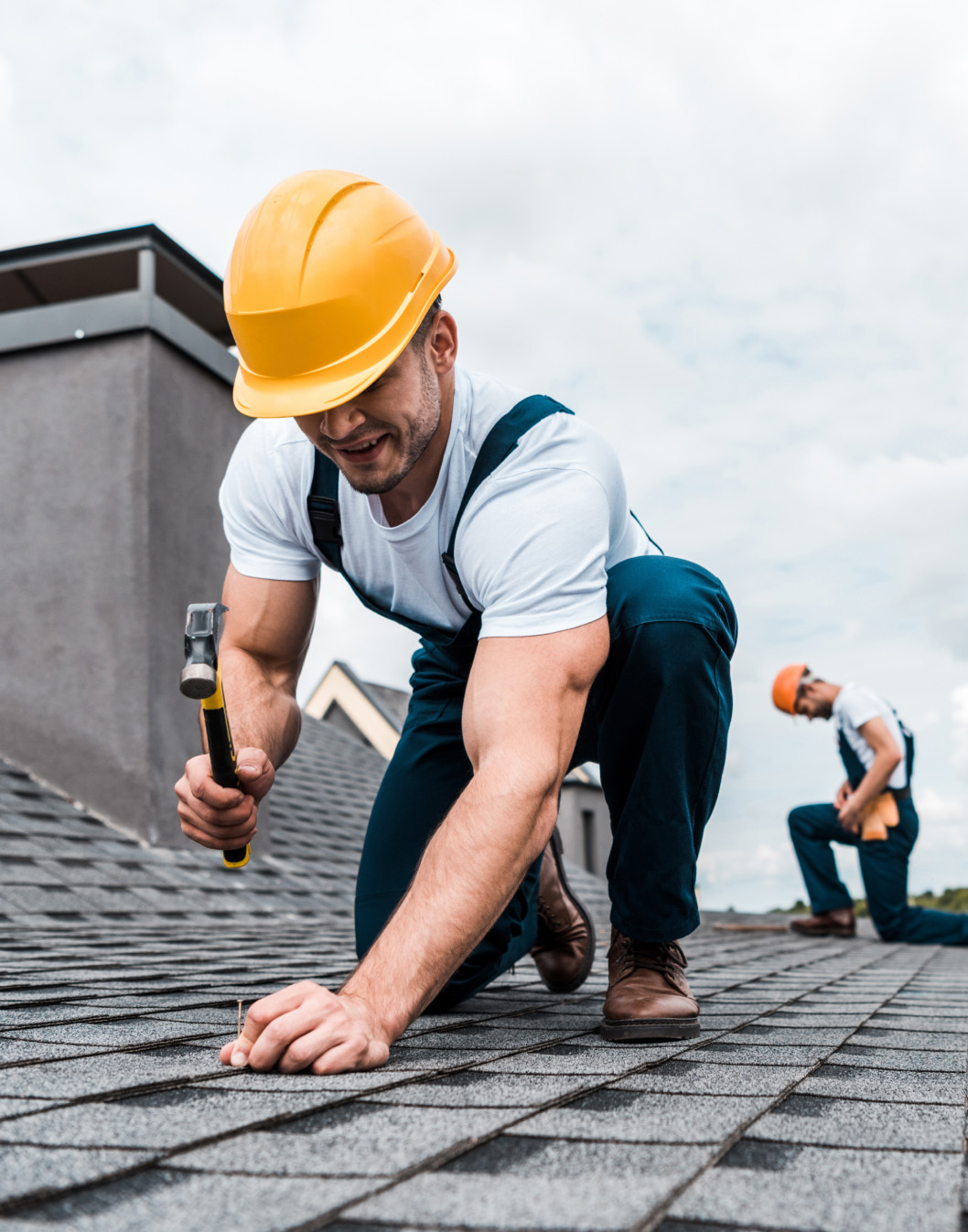 man working on a roof